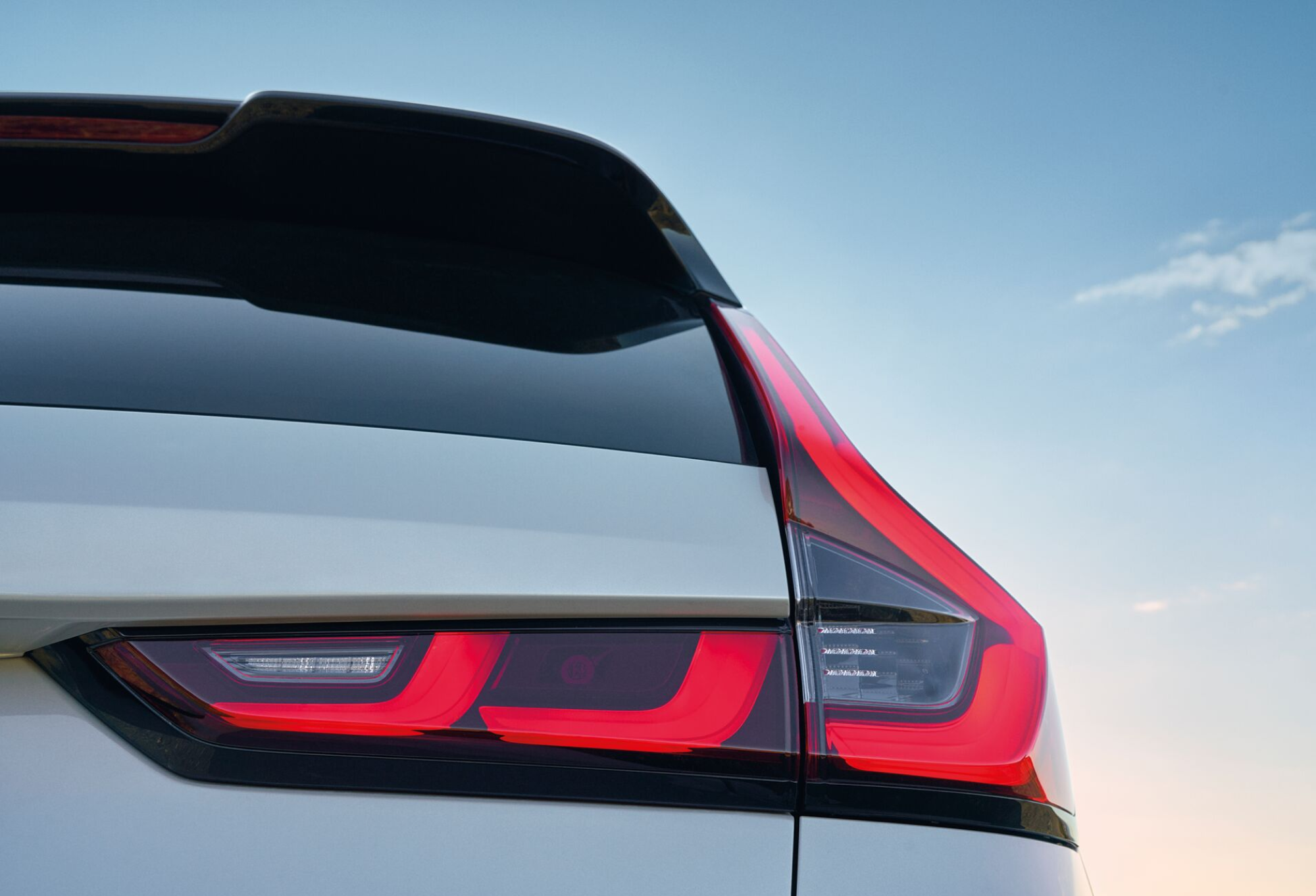 The tail light from a white honda CR-V